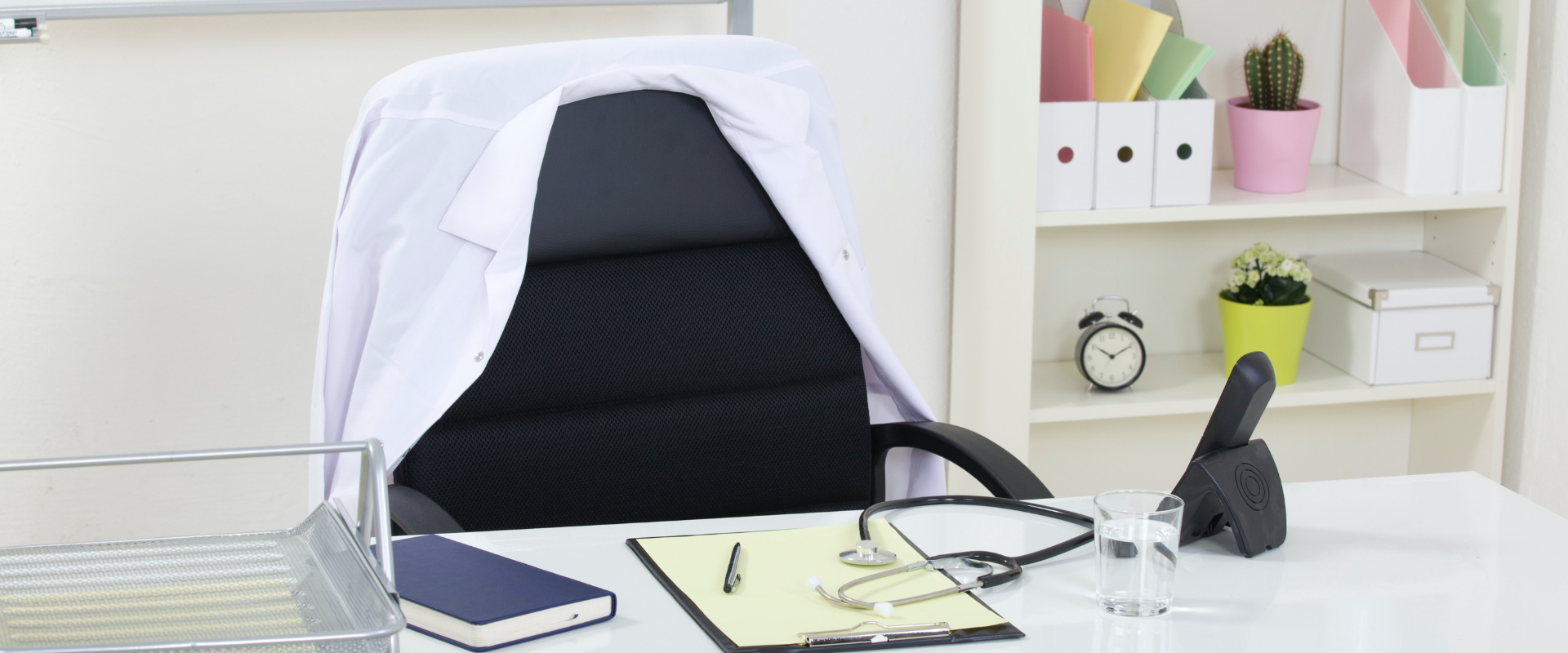 Clinic interior with desk and stethoscope